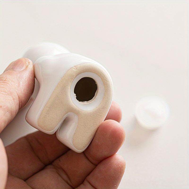 1 Set of Charming Black,White Salt,Pepper Shakers ,Ceramic, Modern Kitchen Spice Jars with Metal Stand, Ideal for Western Dining Table Decor