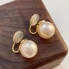 French Retro Pearl Earrings: Trendy 2025 Style with Korean 925 Silver Needle - Elegant Commuting Statement.