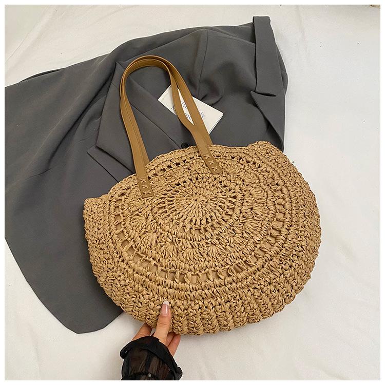

New vacation straw bag women s woven bag beach bag round hollow large capacity tote bag fashionable shoulder bag
