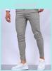 Pantalon slim décontracté pour homme en mélange de coton hautement élastique, idéal pour le streetwear urbain.