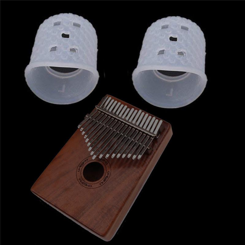 

2 шт. Finger Cover Relief Play Pain Gloves Silicone Hands Coat for Kalimba Thumb Piano Musical прозорий