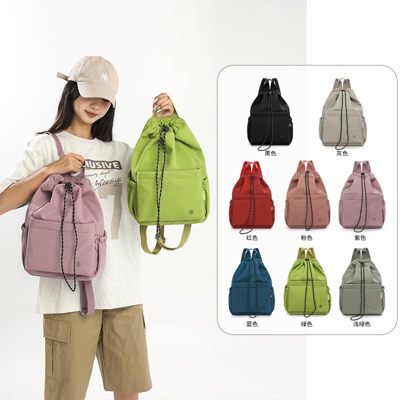 Schoolbag versatile backpack large-capacity design sense commuting travel large-capacity schoolbag waterproof and wear-resistant backpack wholesale
