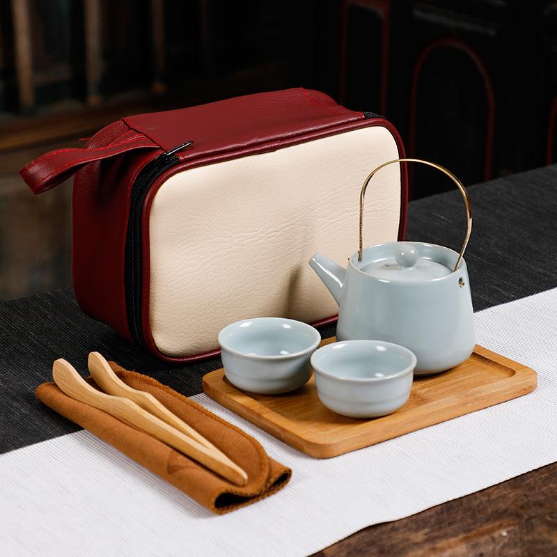 

Travel tea set Portable four cups white porcelain Kuaike cup Outdoor car ceramic Kung Fu tea set Complete household