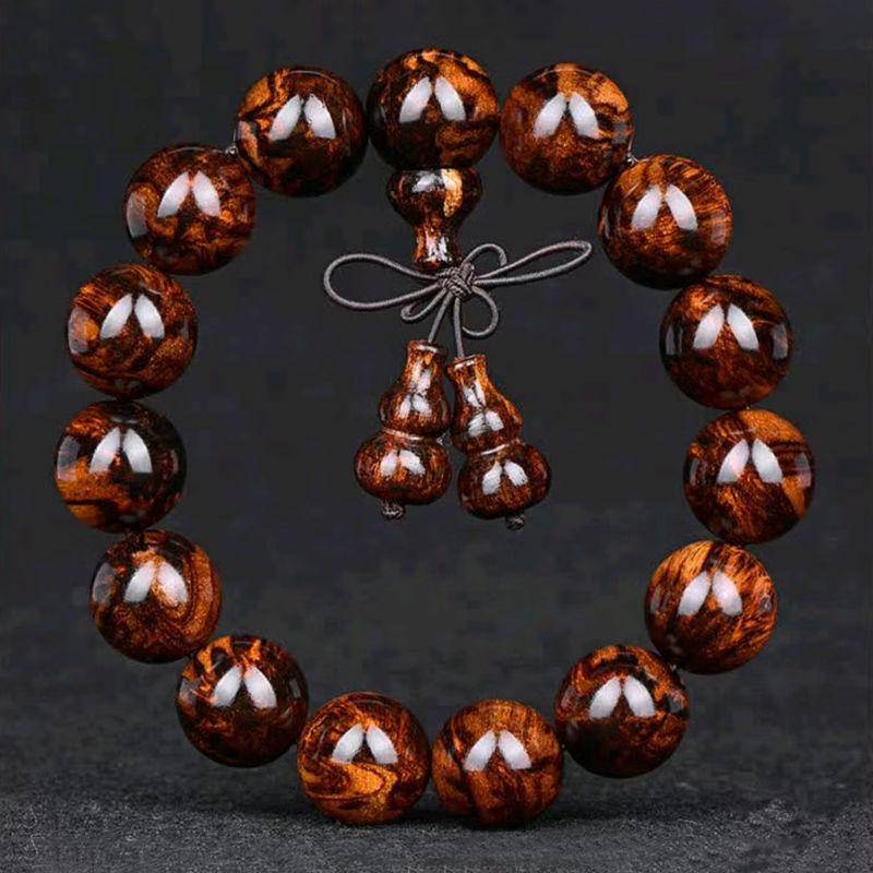 

Authentic Hainan Huanghuali Beads with Ghost Eyes Design 12 pieces - 20mm