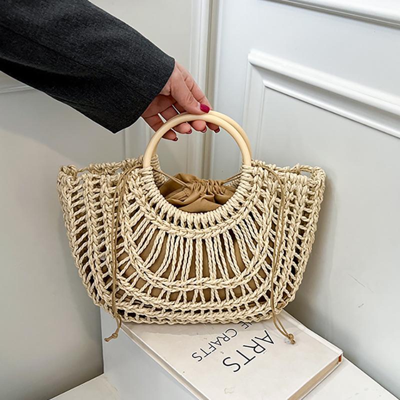 

Summer 2026 Handmade Beach Bag Hollow out Woven Handheld Bag Trend Leisure Style Large Tote Bag Beach Vacation Women s Hand Bag