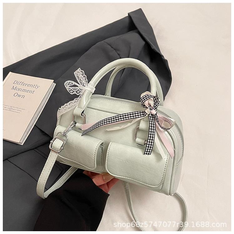 Versatile Korean version ins fashionable new portable Boston bag foreign style solid color oily skin niche simple messenger women's bag