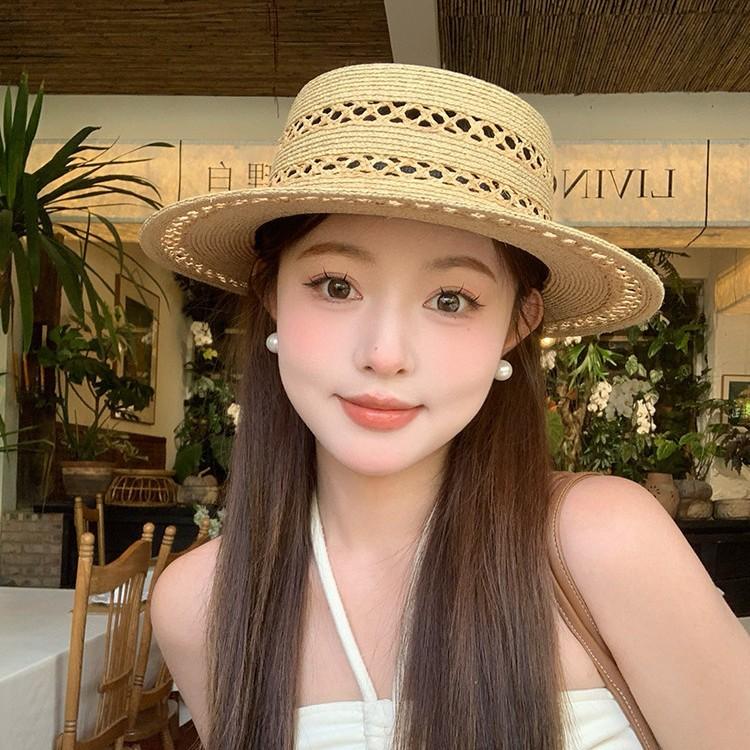 Hand-woven flat-top Lafite straw hat women's summer new hat hollow sunshade sunscreen hat French top hat