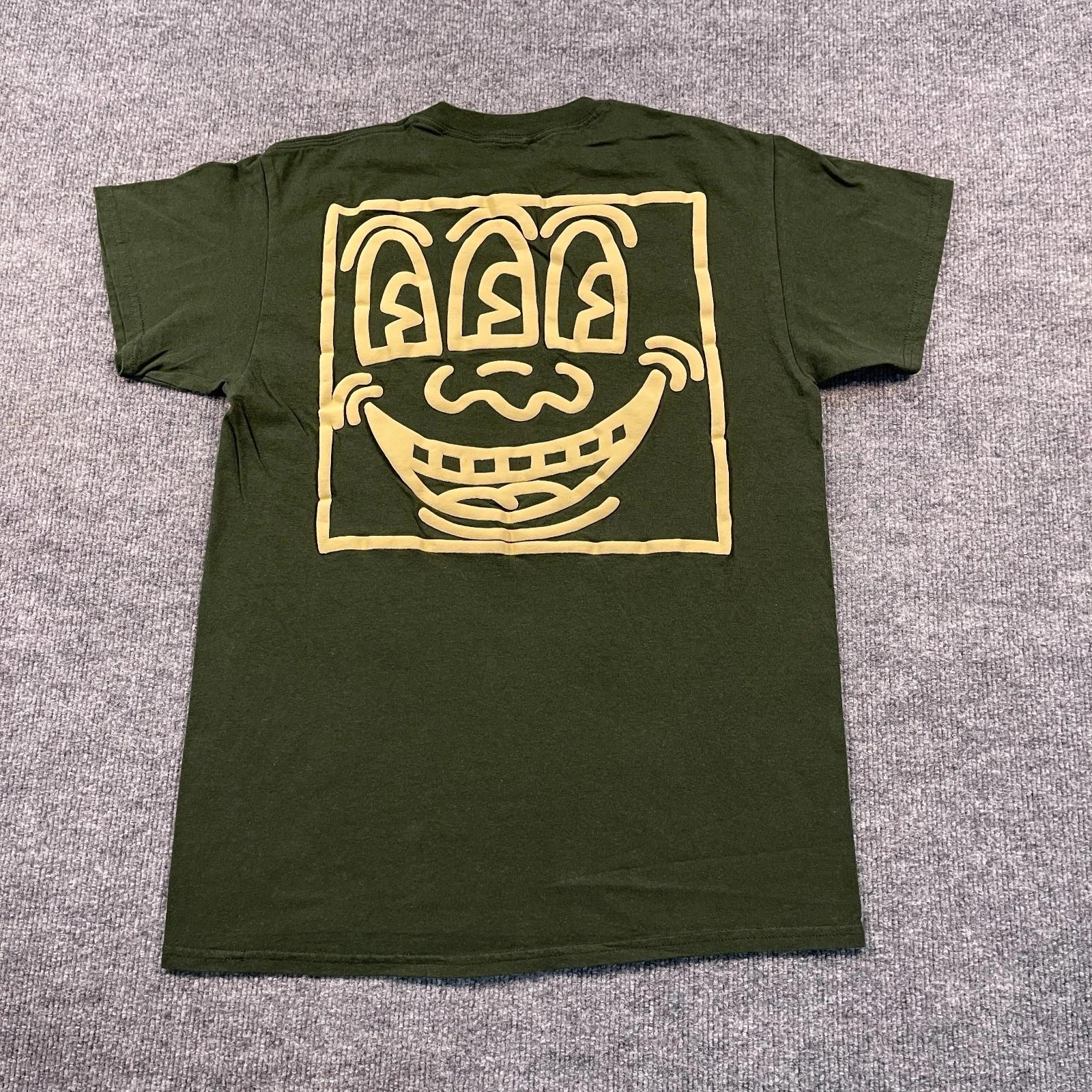 

Футболка с принтом Keith Haring Трехглазый Монстр Смайлик Арт Размер Medium 19x26 Зеленый 4XL
