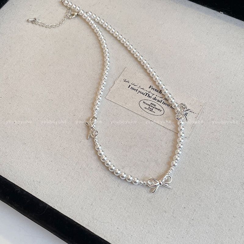 

Французская простота Банты Жемчужное ожерелье для женщин Доступная роскошь Причудливый чокер Цепочка для ключиц Цепочка на шею Украшение Bows pearl necklace