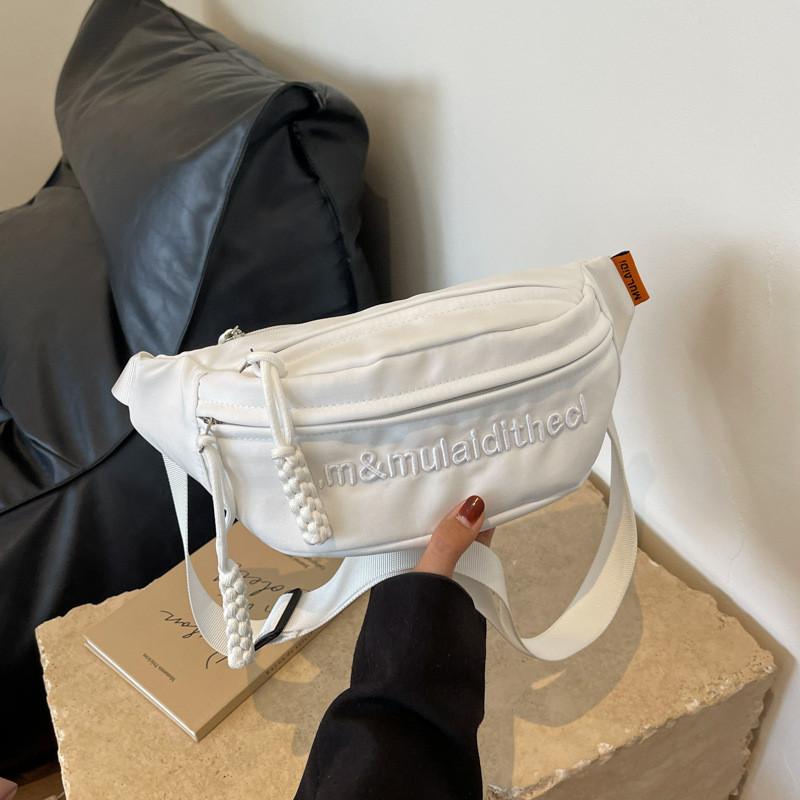 Versatile Water-resistant Canvas Crossbody Bag With Letter Print Perfect For Travel And Casual Use