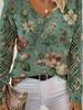 Women's Off-White V-Neck Knit Sweater with Blue Floral Pattern and Lace-Up Sleeve Detail