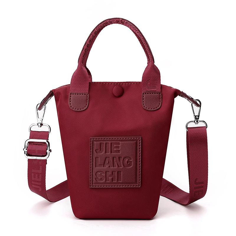 

Женская сумка, Новая ткань Оксфорд, Повседневная сумка для мобильного телефона, Текстурированная нейлоновая мини-сумка-ведро 10*5*20cm