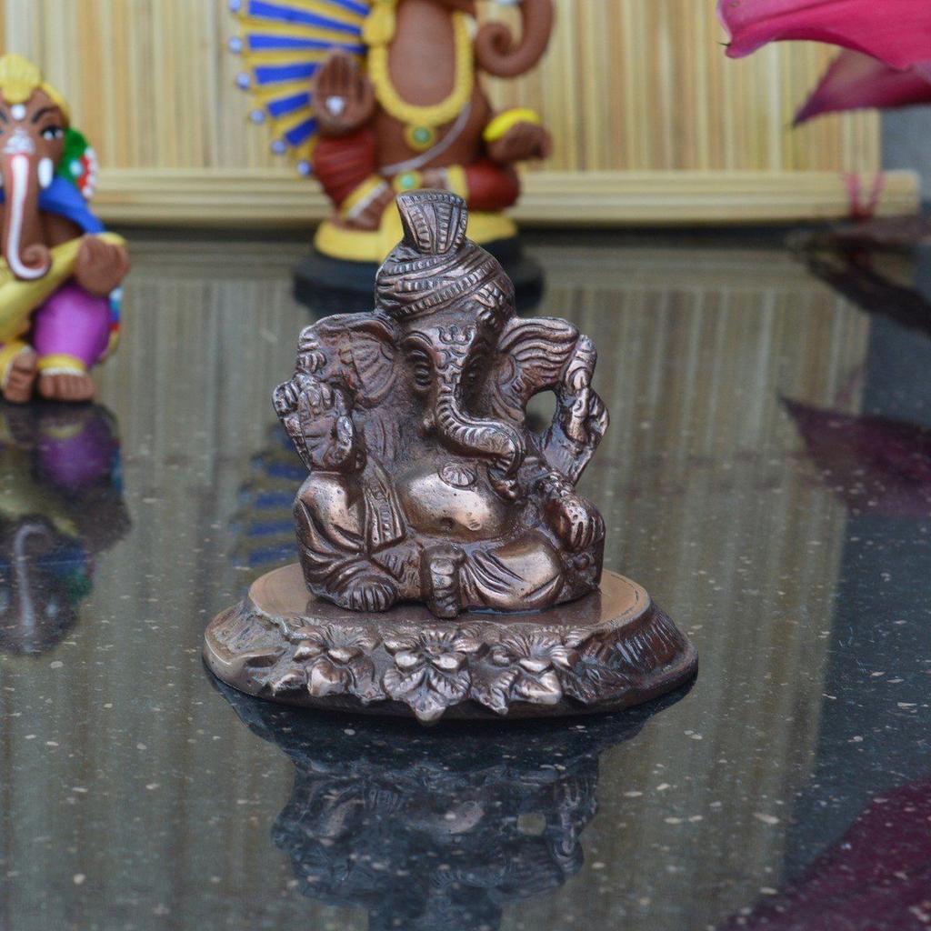 Metal Lord Ganesha On Flower Figurine