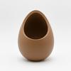 A Modern, Decorative Brown Plant Pot In the Shape of a Nest for Plants.