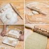 Wooden rolling pin with Christmas patterns and decorative engraving