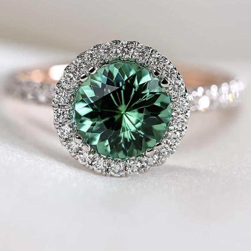 Sanjie European & American Fashion Zircon Women's Ring - Two-Color Alloy with Inlaid Emerald.