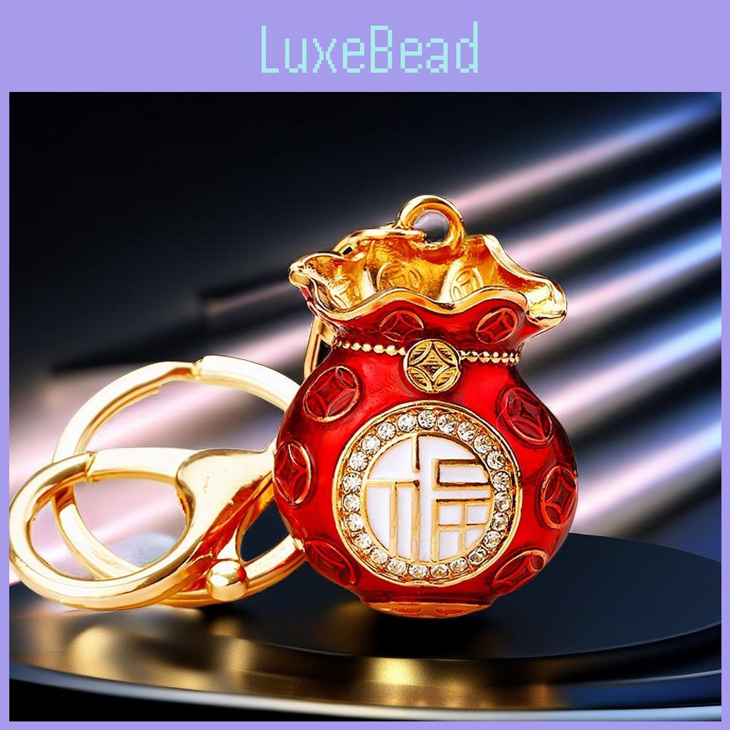Atemberaubender Metall-Schlüsselanhänger mit klassischem rotem Glücksbeutel-Design, perfekt für Geschenke und Accessoires