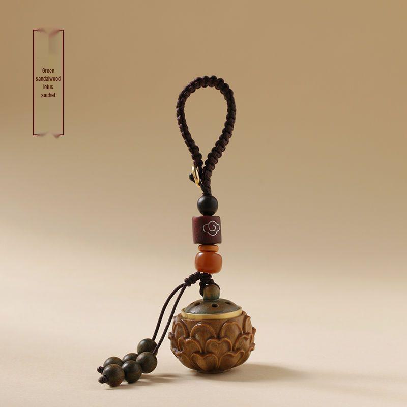 Green Sandalwood Hollow Mobile Phone Chain: Exquisite Aromatherapy Sachet Ball and Tibetan Incense Pendant Keychain in Ancient Style.