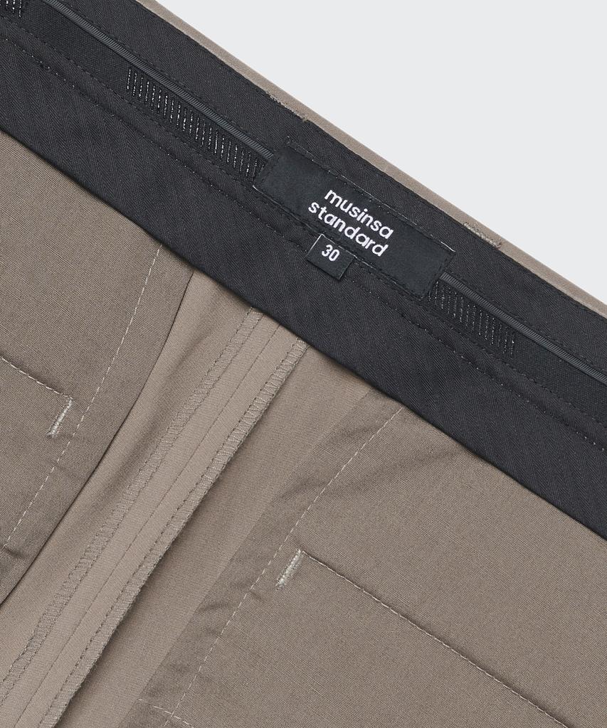 Musinsa Standard [Cooltandard] Tapered Hidden Banding Crop Slacks [Dusty Beige]
