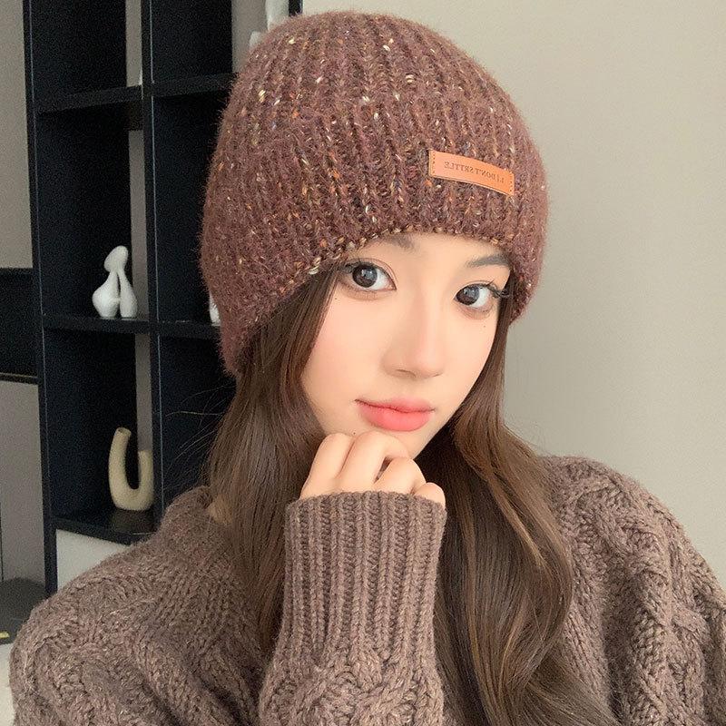 Autumn and winter pullover warm wool hat women's fashion leather label knitted confinement hat outdoor cycling sports hat