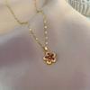 A Stylish Necklace Featuring a Five-Petal Flower Design Made of Stainless Steel, Available in a Vibrant Red Color, Suitable for Both Men And Women