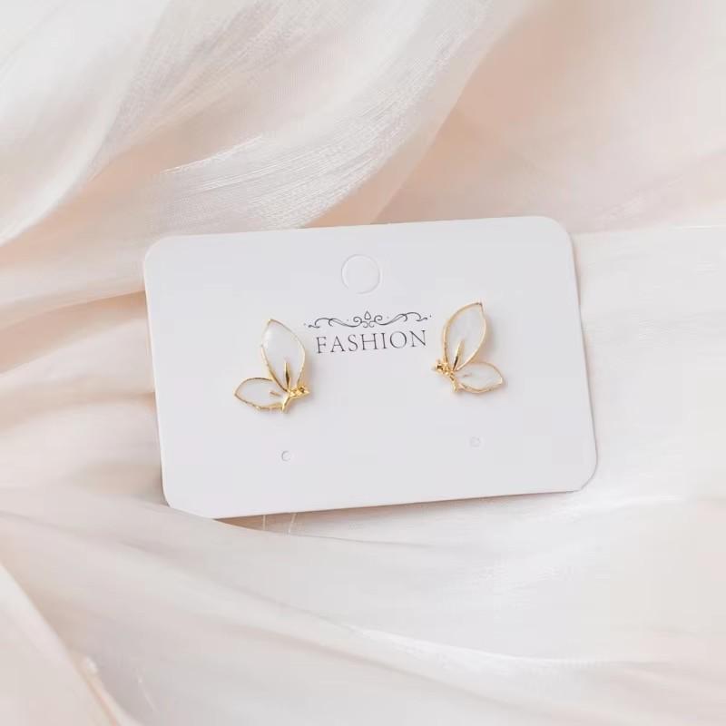 Boucles d'oreilles tendance papillon pour femmes Émail noir Petit cristal Papillon creux en forme d'animal creux Boucles d'oreilles pendantes pour femme