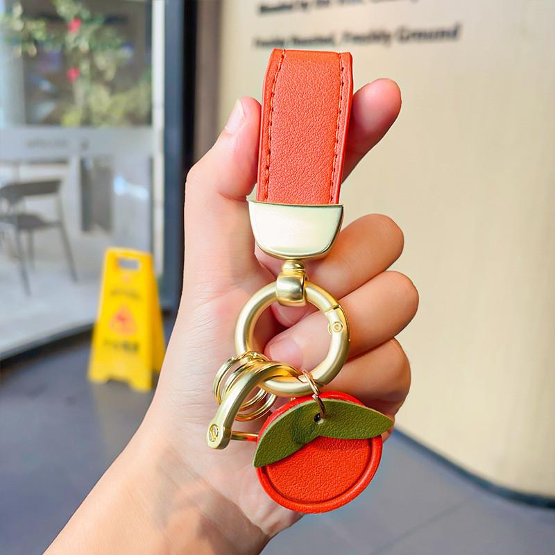 

Модный кулон-брелок с кожаным ремешком, идеально подходящий для вечеринок, встреч и особых случаев оранжевый