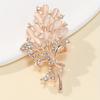 Elegant Floral Brooch with Rhinestone Accents and Oval Gemstone Embellishments Classic Bouquet Design with Ribbon Detail for Women Accessories