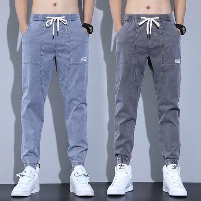 Moda męska czarne niebieskie szare dżinsy Streetwear spodnie do biegania spodnie Plus rozmiar 8XL Casual proste Streetwear sznurek w pasie luźne dżinsy