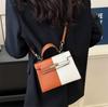 Color Block Kelly Bag: Trendy Two-Tone, Large Capacity, Versatile Shoulder & Crossbody Bag for Work Commute.
