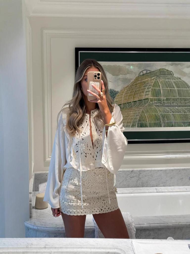 European & American Women's Fashion Tie-Up Cutout Patchwork Two-Piece Set: Round Neck Long Sleeve Top & Mini Skirt for Vacation or Casual Wear.