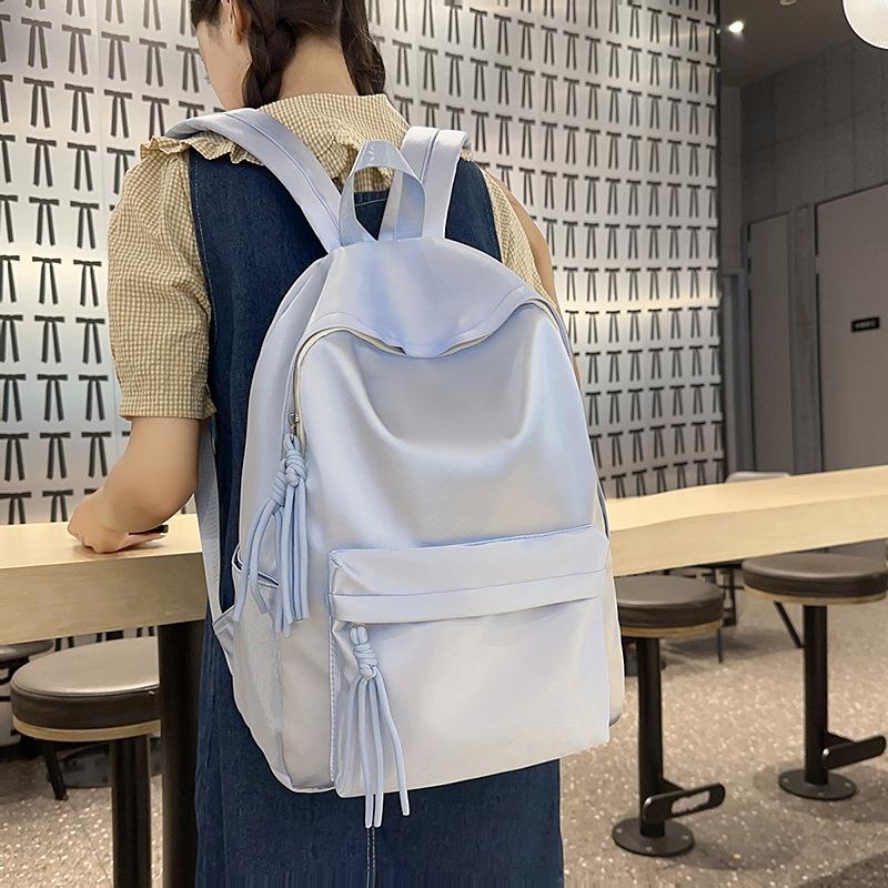 School bag solid color light and simple Korean version of college students Japanese versatile large-capacity small backpack girl light backpack