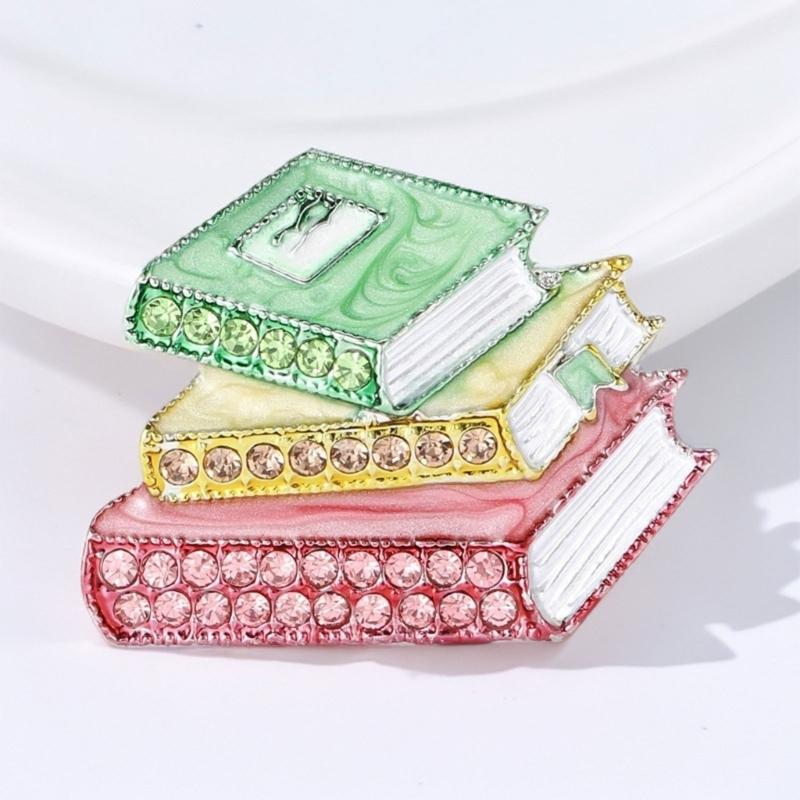 Solidna emaliowana broszka z cyrkoniami i błyszczącymi kamieniami zapewniająca trwały kolor i blask w akcesoriach