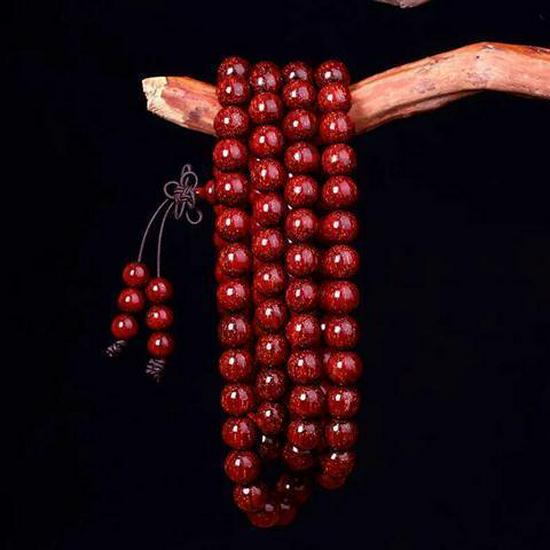 Herren Armband aus rotem Sandelholz mit goldenem Stern Agarholz Buddhistische Gebetsperlen