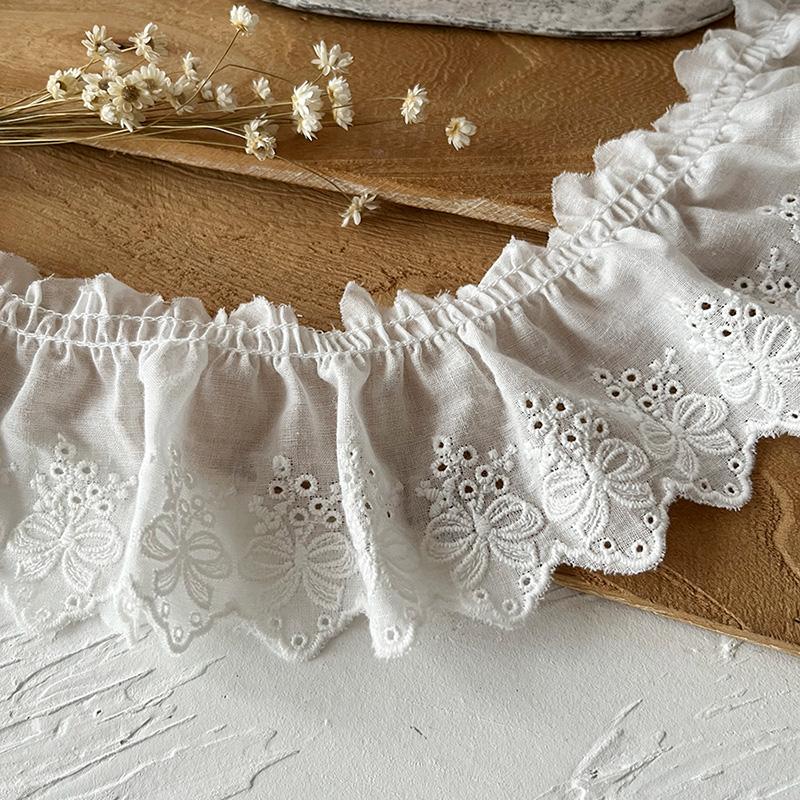 

2 метра/лот 7 см шириной Хлопчатобумажная вышитая кружевная ткань с бантом-складкой Женская юбка Край Манжета Декоративное кружево Аксессуары 2meters бежевый