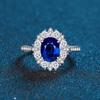 Women's 3.5 Carat Egg-shaped Ring: S925 Sterling Silver with Simulated Pigeon Blood Red, Green, and Nano Blue Stones and Full Diamond Accents.