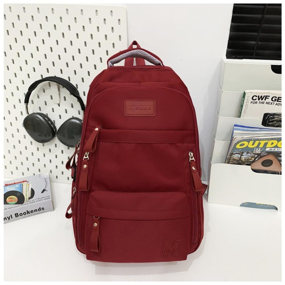 

Korean version of the new large-capacity casual backpack simple middle and high school student schoolbag solid color versatile couple backpack single package красный