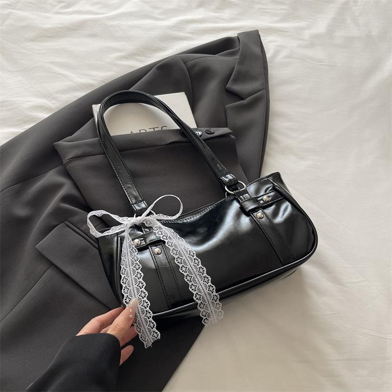 French niche bag women's new bow pillow bag shoulder messenger bag portable baguette bag