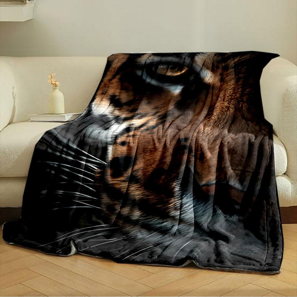 Close-up of tiger's face with striped fur pattern and piercing eye. for all seasons blanket lunch break throw gift