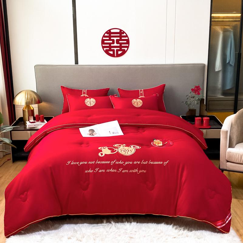Four-Piece Red Bridal Chamber Wedding Bedding Set with Embroidered Duvet Cover and Bed Sheet.