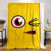 Yellow background with a winking cartoon face, red eye, and open mouth. for all seasons blanket lunch break throw gift