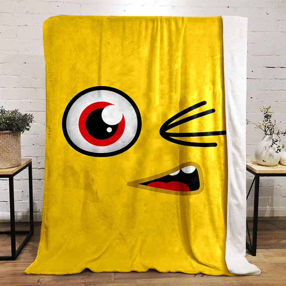 Yellow background with a winking cartoon face, red eye, and open mouth. for all seasons blanket lunch break throw gift