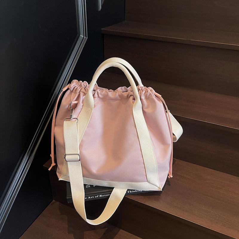 Canvas bag, female tote bag, large-capacity messenger 2025 new spring and summer versatile college student class commuting bag