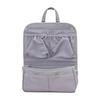Water-repellent, lightweight, large-capacity backpack-in-bag with drink holder and multiple pockets for organization and storage. Stylish inner bag