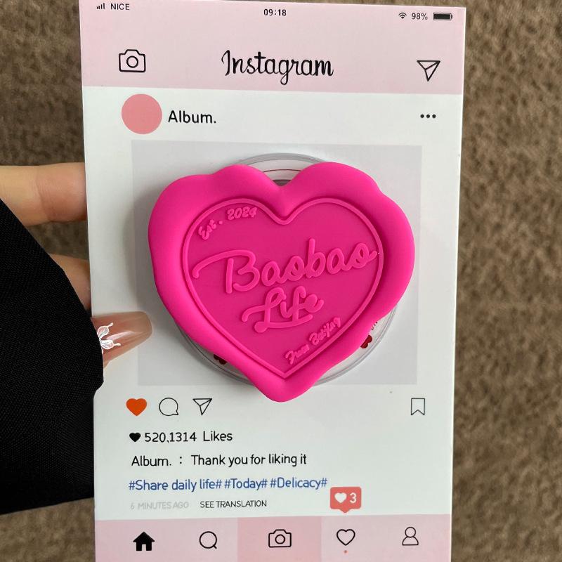 MagSafe-Compatible Silicone Heart Stand with Strong Magnetic Hold and Retractable Airbag Design for Desktop Use