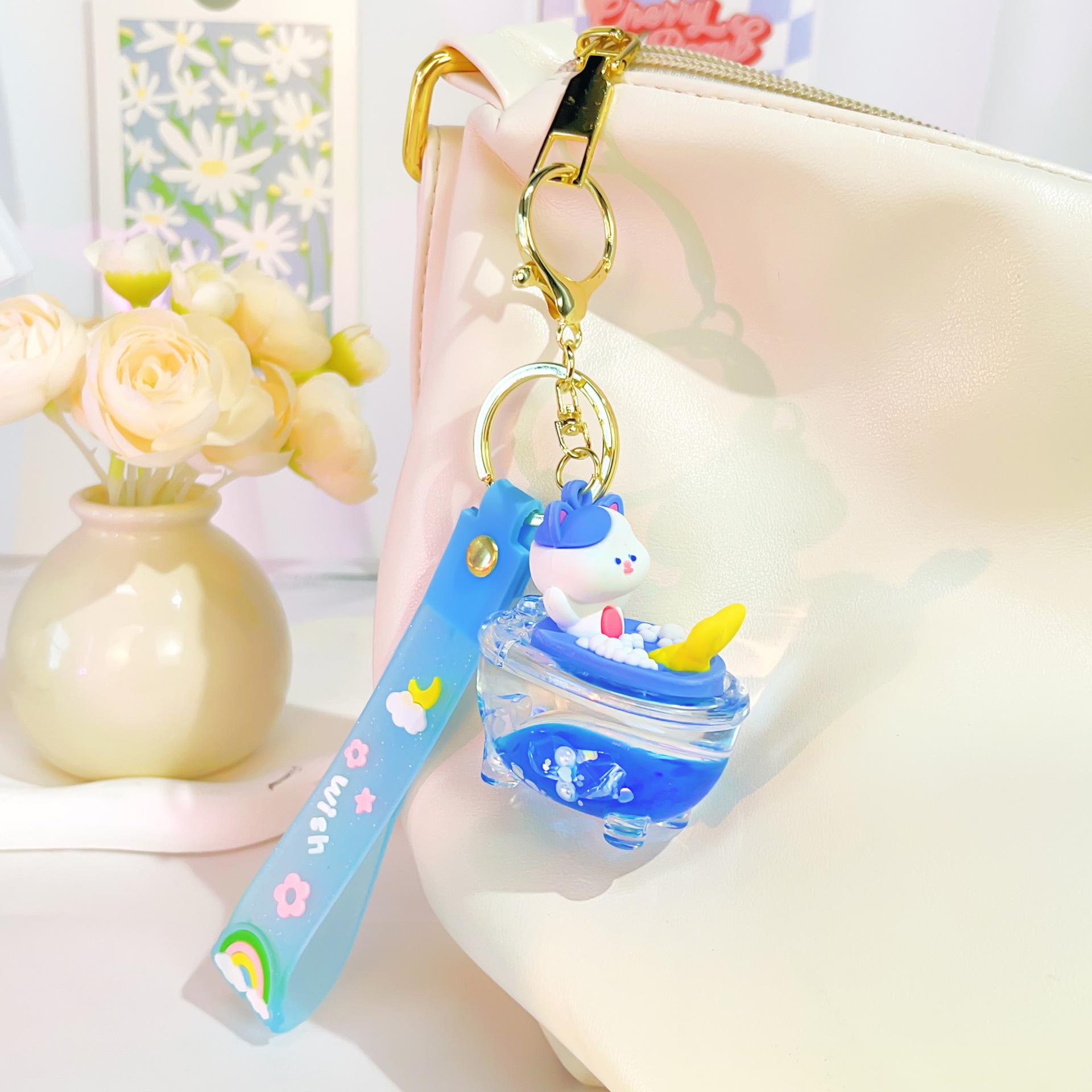 

Mermaid Bathtub Keychain with Liquid Sand & Bathing Bear Pendant
