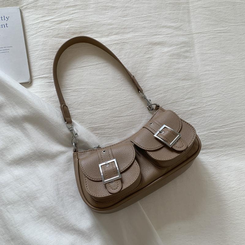 

French niche high-value dumpling bag women s 2025 new casual commuter underarm shoulder bag foreign underarm bag коричневый