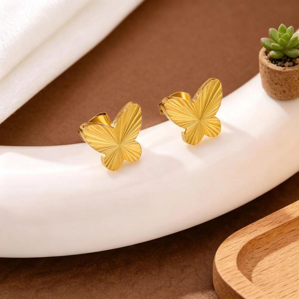 Gold Plated Titanium Steel Jewelry Set with Butterfly Carving: Necklace, Bracelet, and Earrings.