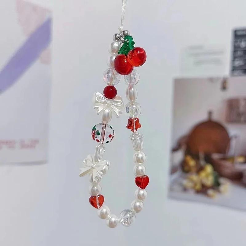 

Korean Cute Red Cherry Bow Pearl Phone Chain Lanyard Charm Strap Wrist Bead Hanging Cord Bracelet Keychain For iPhone Girl Rope Lanyard