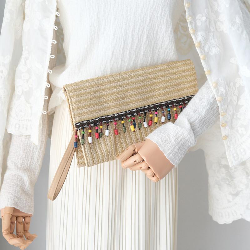 Neue Frühling Sommer Trendy Handtasche Mode Frauen Tasche Solide Stroh Casual Kupplung Frau Niedlich Quaste Vintage Strand Kleine Reise Handtasche